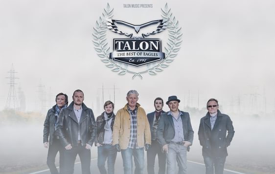 7 men walking towards the camera in jeans and jackets down a lond desert road. "Busy Beimg Fabulous" written in white at the bottom of the image and the Talon logo at the top in black.