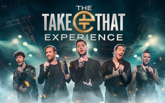 Five men singing emotionally into microphones being lit by white and blue stadium lights underneath the silver show title "The Take That Experience"