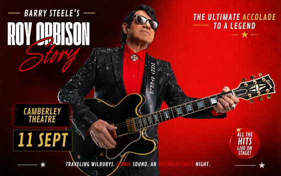 Rad back ground man with black hair, jacket and guitar as Roy Orbison