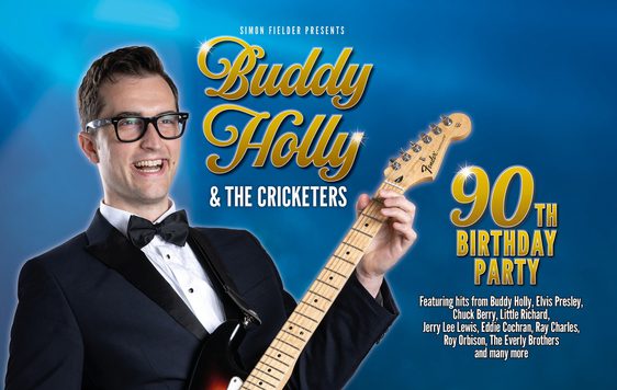 Man dressed in dress suite as 'Buddy' holding guitar with show title in gold writing