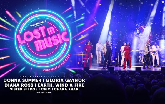 The show title "Lost in Music" is shown in neon lights next to a group of performers on stage in front of an audience.