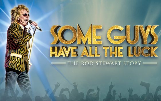 A performer dressed as Rod Stewart in the tiger print jacket is singing into a microphone against a blue background with the show title shown next to him.